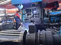 Workers work at a stainless steel material processing enterprise in Qingzhou, China, on October 13, 2024. (