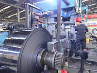 Workers work at a stainless steel material processing enterprise in Qingzhou, China, on October 13, 2024. (