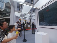 Young audiences and parents experience flying ''kites'' in digital ancient paintings at the 2024 Hangzhou (International) Future Life Explor...