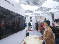 A citizen conducts a digital doll to perform Chaoshan-Ying song and dance at the 2024 Hangzhou (International) Future Life Exploration Day i...