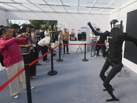 Citizens watch a universal pedestrian robot of Unitree Technology perform a dance performance at the 2024 Hangzhou (International) Future Li...