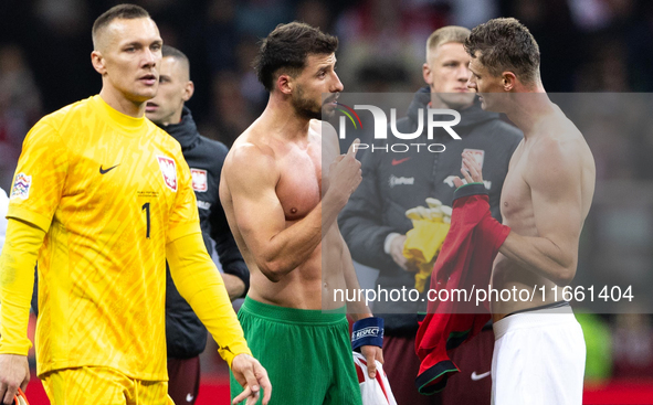 Ruben Dias (C) and Pawel Dawidowicz (R) talk after  the  UEFA Nations League 2024 League A Group A1 match between Poland and Portugal , at t...