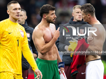 Ruben Dias (C) and Pawel Dawidowicz (R) talk after  the  UEFA Nations League 2024 League A Group A1 match between Poland and Portugal , at t...