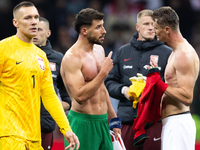 Ruben Dias (C) and Pawel Dawidowicz (R) talk after  the  UEFA Nations League 2024 League A Group A1 match between Poland and Portugal , at t...