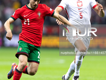 Diogo Jota and Jan Bednarek compete during the  UEFA Nations League 2024 League A Group A1 match between Poland and Portugal , at the PGE Na...