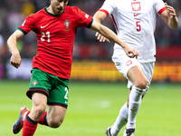 Diogo Jota and Jan Bednarek compete during the  UEFA Nations League 2024 League A Group A1 match between Poland and Portugal , at the PGE Na...