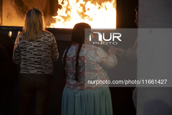 Pilgrims hold candles and pray during the candle procession at the Sanctuary of Fatima, in Fatima, Portugal, on October 12, 2024, on the ann...