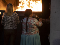 Pilgrims hold candles and pray during the candle procession at the Sanctuary of Fatima, in Fatima, Portugal, on October 12, 2024, on the ann...