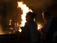 Pilgrims hold candles and pray during the candle procession at the Sanctuary of Fatima, in Fatima, Portugal, on October 12, 2024, on the ann...