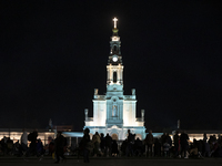 Pilgrims hold candles and pray during the candle procession at the Sanctuary of Fatima, in Fatima, Portugal, on October 12, 2024, on the ann...