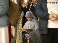 Pilgrims hold candles and pray during the candle procession at the Sanctuary of Fatima, in Fatima, Portugal, on October 12, 2024, on the ann...