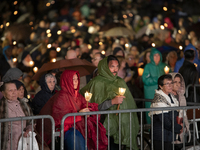 Pilgrims hold candles and pray during the candle procession at the Sanctuary of Fatima, in Fatima, Portugal, on October 12, 2024, on the ann...