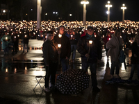 Pilgrims hold candles and pray during the candle procession at the Sanctuary of Fatima, in Fatima, Portugal, on October 12, 2024, on the ann...