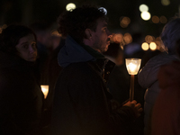 Pilgrims hold candles and pray during the candle procession at the Sanctuary of Fatima, in Fatima, Portugal, on October 12, 2024, on the ann...