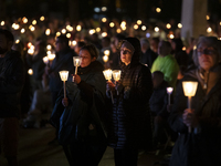 Pilgrims hold candles and pray during the candle procession at the Sanctuary of Fatima, in Fatima, Portugal, on October 12, 2024, on the ann...