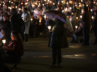 Pilgrims hold candles and pray during the candle procession at the Sanctuary of Fatima, in Fatima, Portugal, on October 12, 2024, on the ann...