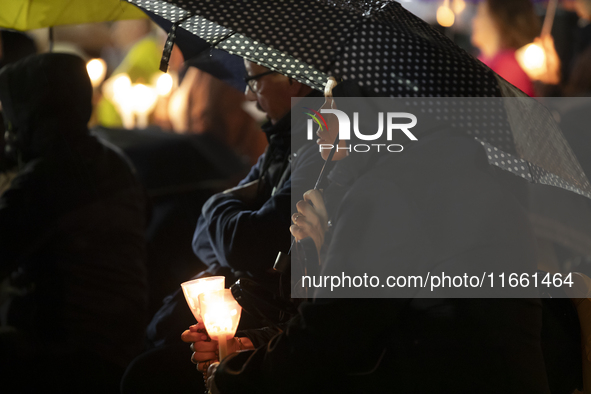 Pilgrims hold candles and pray during the candle procession at the Sanctuary of Fatima, in Fatima, Portugal, on October 12, 2024, on the ann...