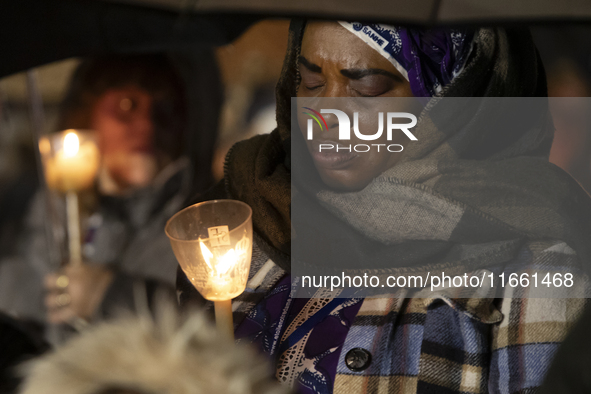 Pilgrims hold candles and pray during the candle procession at the Sanctuary of Fatima, in Fatima, Portugal, on October 12, 2024, on the ann...