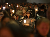 Pilgrims hold candles and pray during the candle procession at the Sanctuary of Fatima, in Fatima, Portugal, on October 12, 2024, on the ann...