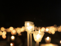 Pilgrims hold candles and pray during the candle procession at the Sanctuary of Fatima, in Fatima, Portugal, on October 12, 2024, on the ann...