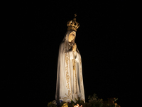 Pilgrims hold candles and pray during the candle procession at the Sanctuary of Fatima, in Fatima, Portugal, on October 12, 2024, on the ann...