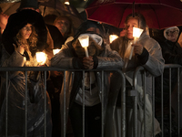 Pilgrims hold candles and pray during the candle procession at the Sanctuary of Fatima, in Fatima, Portugal, on October 12, 2024, on the ann...