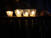 Pilgrims hold candles and pray during the candle procession at the Sanctuary of Fatima, in Fatima, Portugal, on October 12, 2024, on the ann...