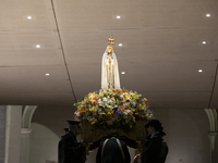 Pilgrims hold candles and pray during the candle procession at the Sanctuary of Fatima, in Fatima, Portugal, on October 12, 2024, on the ann...