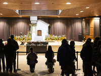 Pilgrims hold candles and pray during the candle procession at the Sanctuary of Fatima, in Fatima, Portugal, on October 12, 2024, on the ann...