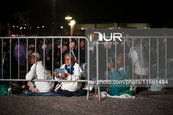 Pilgrims hold candles and pray during the candle procession at the Sanctuary of Fatima, in Fatima, Portugal, on October 12, 2024, on the ann...