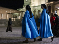 Pilgrims hold candles and pray during the candle procession at the Sanctuary of Fatima, in Fatima, Portugal, on October 12, 2024, on the ann...