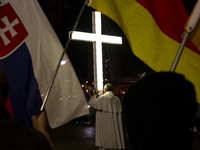 Pilgrims hold candles and pray during the candle procession at the Sanctuary of Fatima, in Fatima, Portugal, on October 12, 2024, on the ann...