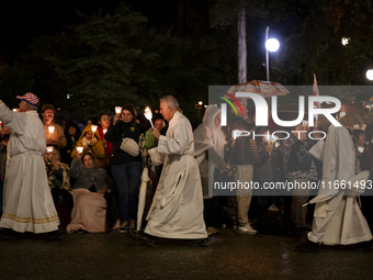 Pilgrims hold candles and pray during the candle procession at the Sanctuary of Fatima, in Fatima, Portugal, on October 12, 2024, on the ann...