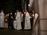 Pilgrims hold candles and pray during the candle procession at the Sanctuary of Fatima, in Fatima, Portugal, on October 12, 2024, on the ann...