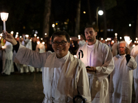 Pilgrims hold candles and pray during the candle procession at the Sanctuary of Fatima, in Fatima, Portugal, on October 12, 2024, on the ann...