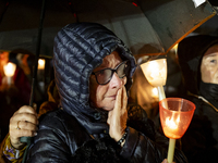 Pilgrims hold candles and pray during the candle procession at the Sanctuary of Fatima, in Fatima, Portugal, on October 12, 2024, on the ann...