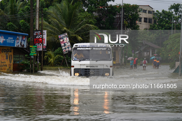 A lorry moves on the flooded road in Kelaniya, Sri Lanka, on October 13, 2024. The adverse weather affects approximately 76,218 people from...