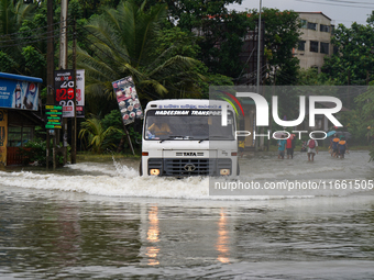 A lorry moves on the flooded road in Kelaniya, Sri Lanka, on October 13, 2024. The adverse weather affects approximately 76,218 people from...