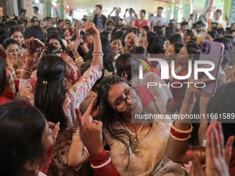 A Hindu devotee dances to celebrate the Durga Puja in Dhaka, Bangladesh, on October 13, 2024. (