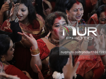 A Hindu devotee dances to celebrate the Durga Puja in Dhaka, Bangladesh, on October 13, 2024. (