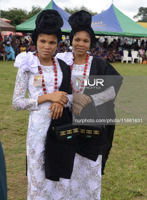 Kehinde Oladapo and Taiwo Oladapo, female twins, pose for a photograph during the 2024 edition of the annual World Twins Festival in Igbo-Or...