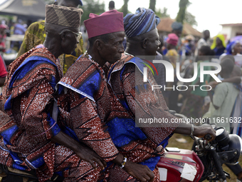 Three men on a motorcycle depart at the end of the 2024 edition of the annual World Twins Festival held in Igbo-Ora, Nigeria, on October 12,...