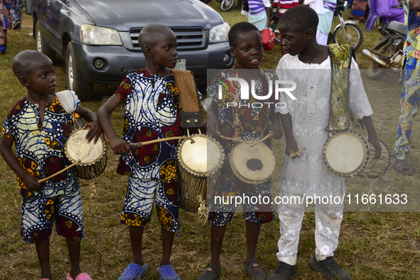 Four boys drum traditional drums to entertain visitors during the 2024 edition of the annual World Twins Festival in Igbo-Ora, the Land of T...