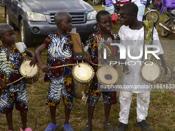 Four boys drum traditional drums to entertain visitors during the 2024 edition of the annual World Twins Festival in Igbo-Ora, the Land of T...