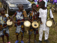 Four boys drum traditional drums to entertain visitors during the 2024 edition of the annual World Twins Festival in Igbo-Ora, the Land of T...