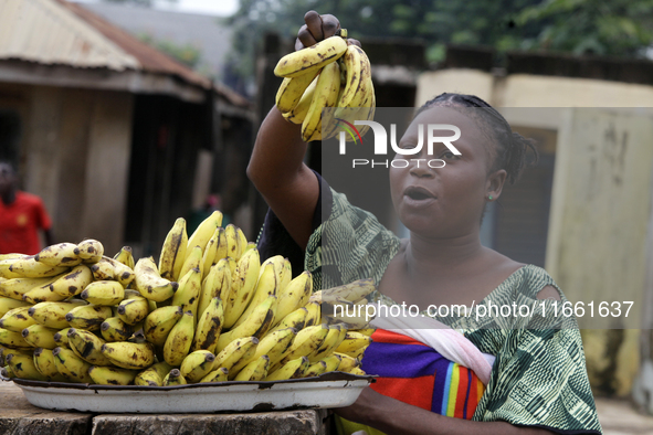 A woman displays bananas for sale during the 2024 edition of the annual World Twins Festival in Igbo-Ora, Oyo State, Nigeria, on October 12,...