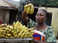 A woman displays bananas for sale during the 2024 edition of the annual World Twins Festival in Igbo-Ora, Oyo State, Nigeria, on October 12,...