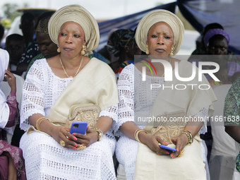 Mrs. Kehinde Oladosu (L) and Mrs. Taiwo Ipadeola, twins, sit during the 2024 edition of the annual World Twins Festival in Igbo-Ora, the Lan...