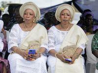 Mrs. Kehinde Oladosu (L) and Mrs. Taiwo Ipadeola, twins, sit during the 2024 edition of the annual World Twins Festival in Igbo-Ora, the Lan...