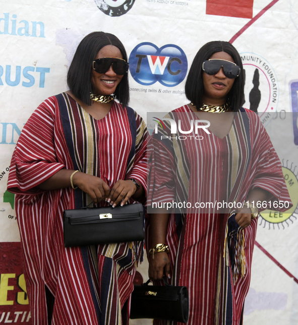 L-R: Taiwo Adeleke and Kehinde Adeleke, female twins, pose for a photograph during the 2024 edition of the annual World Twins Festival in Ig...